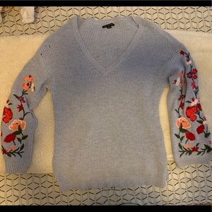 American Eagle blue sweater with floral sleeves